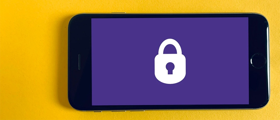 smartphone with purple background and white lock icon on yellow surface