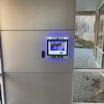 mvi keycom mounted on wall by building entrance