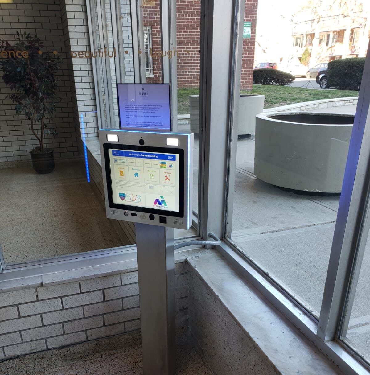 mvi keycom mounted on metal stand inside of building