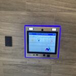 mvi keycom mounted on wood wall