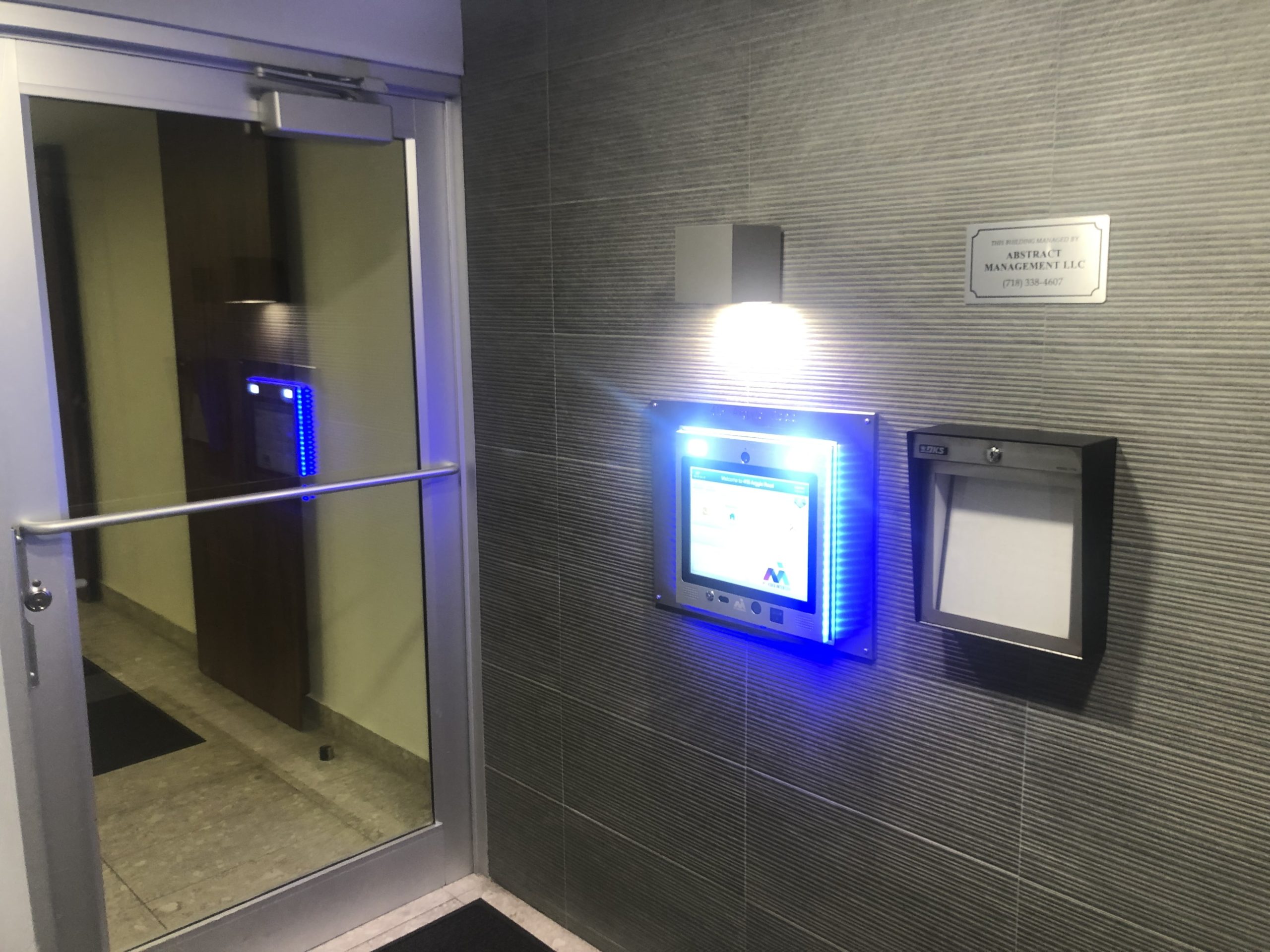 mvi keycom mounted on wall by office entrance
