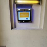 mvi keycom system mounted on wall by building entrance
