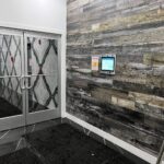 mvi access system installed on wood wall by apartment entrance
